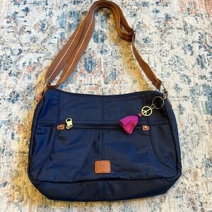 The Sak Navy Esperato Hobo Bag with Pink Tassel Charm
